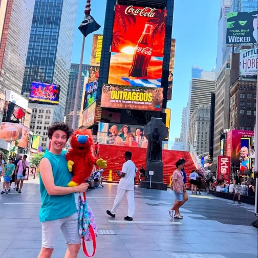 Zack and Ticklemuff posing together in Times Square, New York City